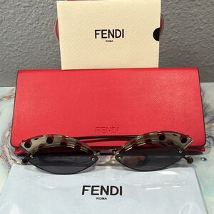 Fendi sunglasses with case, cleaning cloth, and authentication card